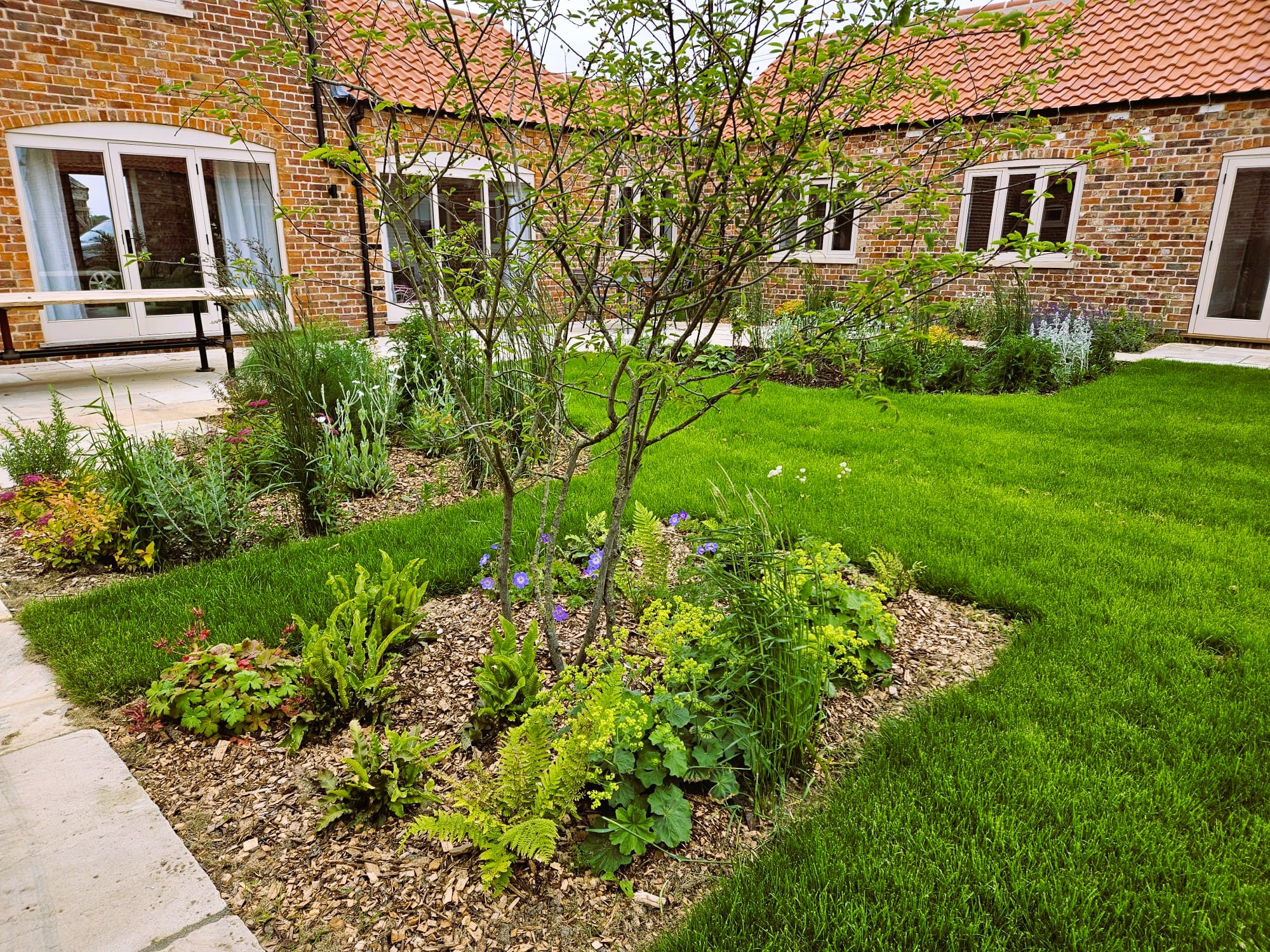 Lincolnshire Barn Conversion Garden with Seasonal Beauty. Low maintenance garden design near Sleaford and Spalding